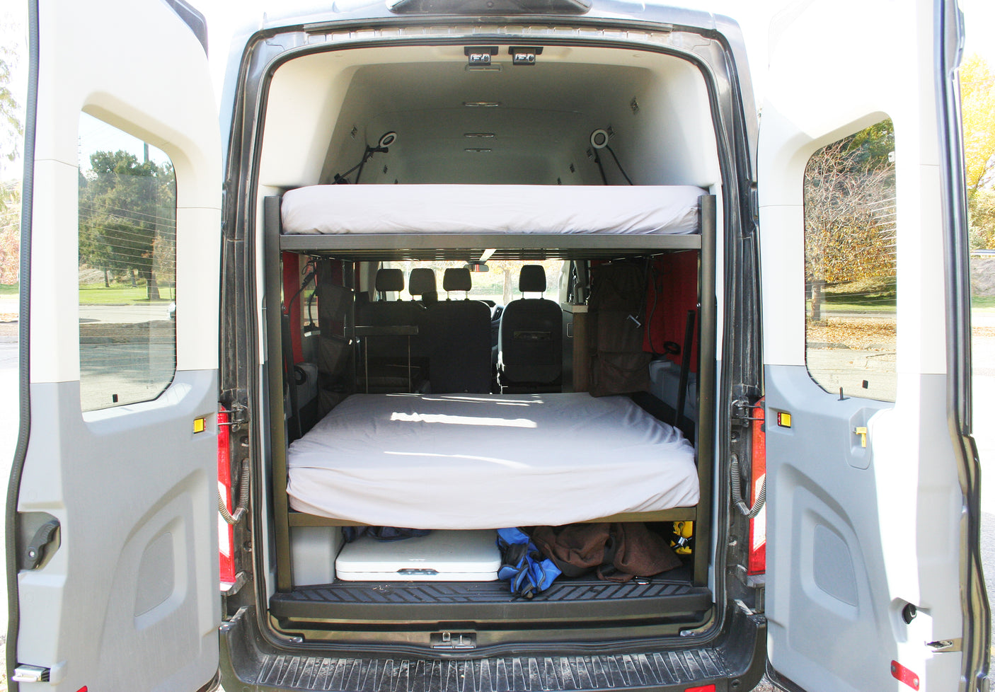 Inside this RV rental camper van: stacked bunk beds and under-bed storage for your next adventure.