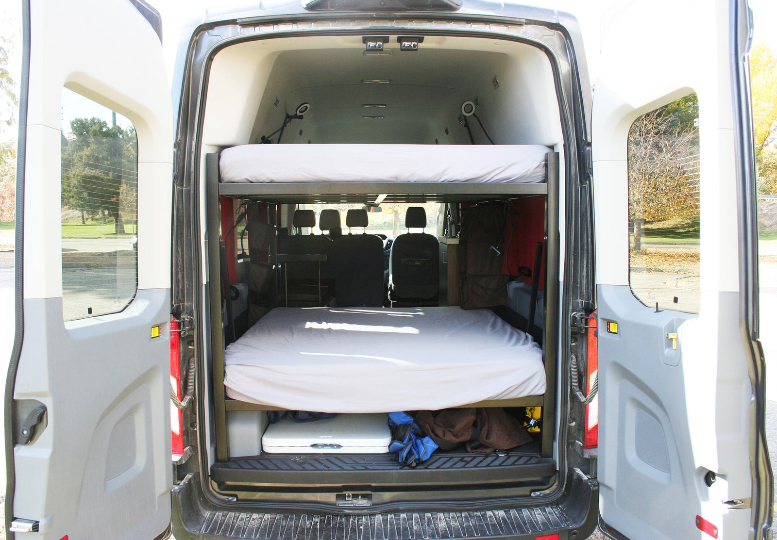 Inside this RV rental camper van: stacked bunk beds and under-bed storage for your next adventure.
