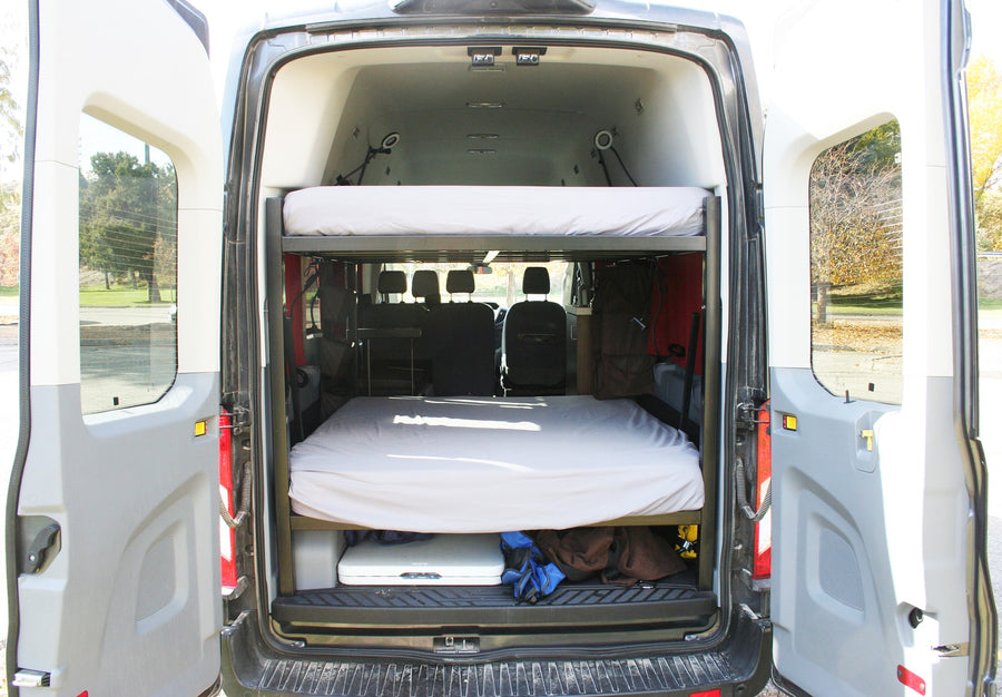 Inside this RV rental camper van: stacked bunk beds and under-bed storage for your next adventure.