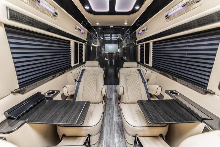and wood-look flooring visible through an open door.|This silver Mercedes-Benz Sprinter luxury van