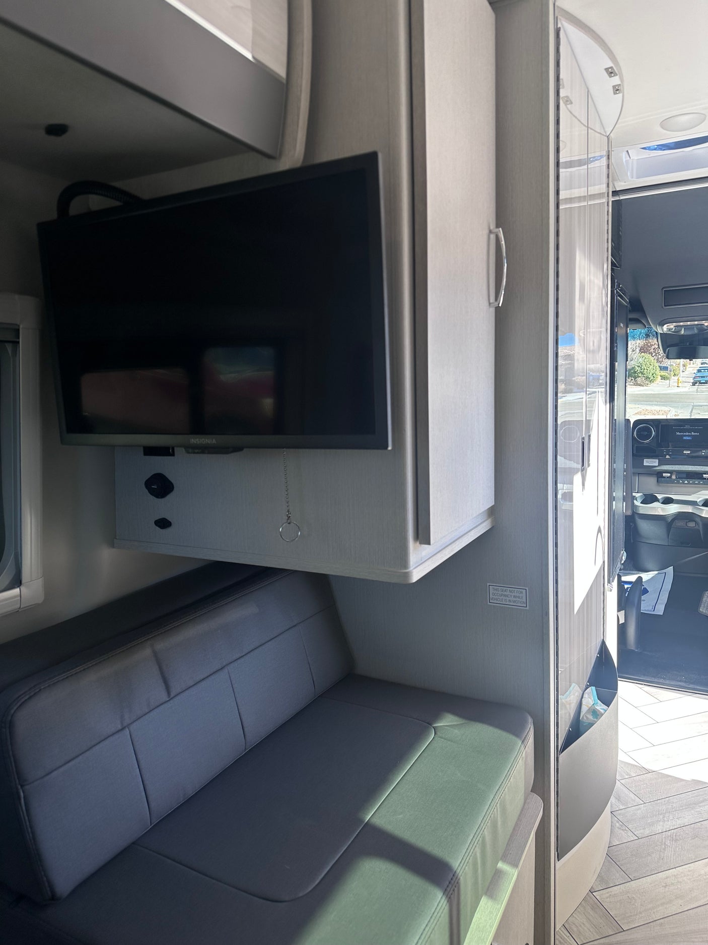 and covered sink. Side door open to street view.|RV rental: A bright