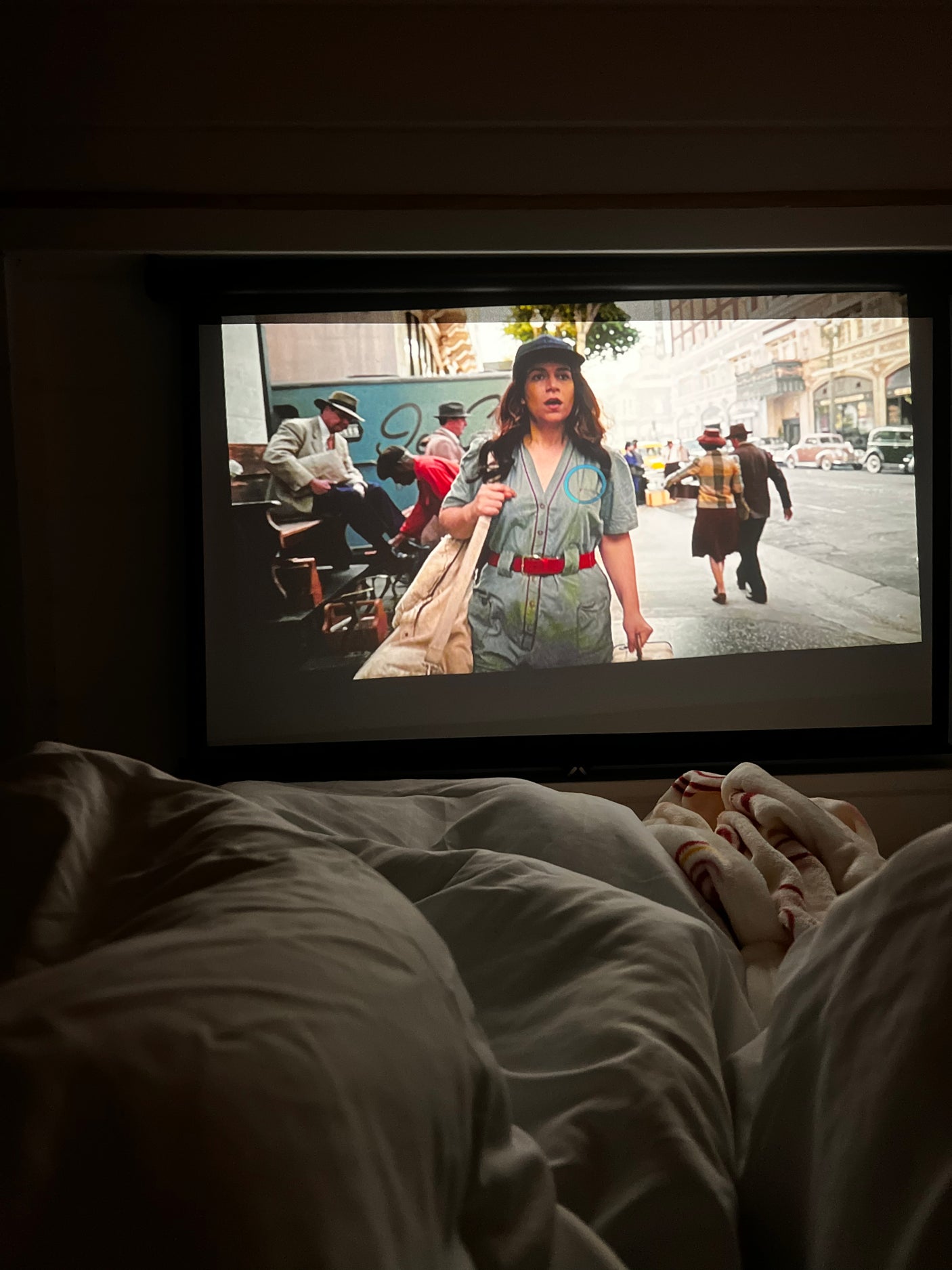 Cozy in bed, watching a movie on a large projector screen. Relaxing after dreaming of my next big adventure, maybe an RV rental trip!