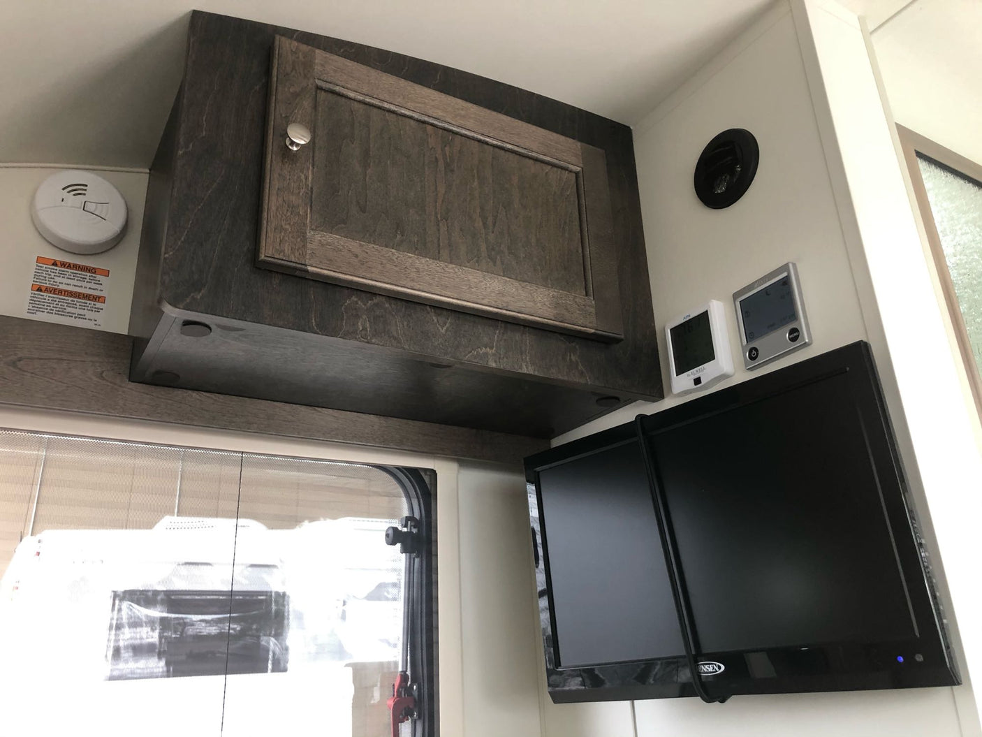 and a window.|Inside an RV rental: a flexible sleeping area with modular cushions