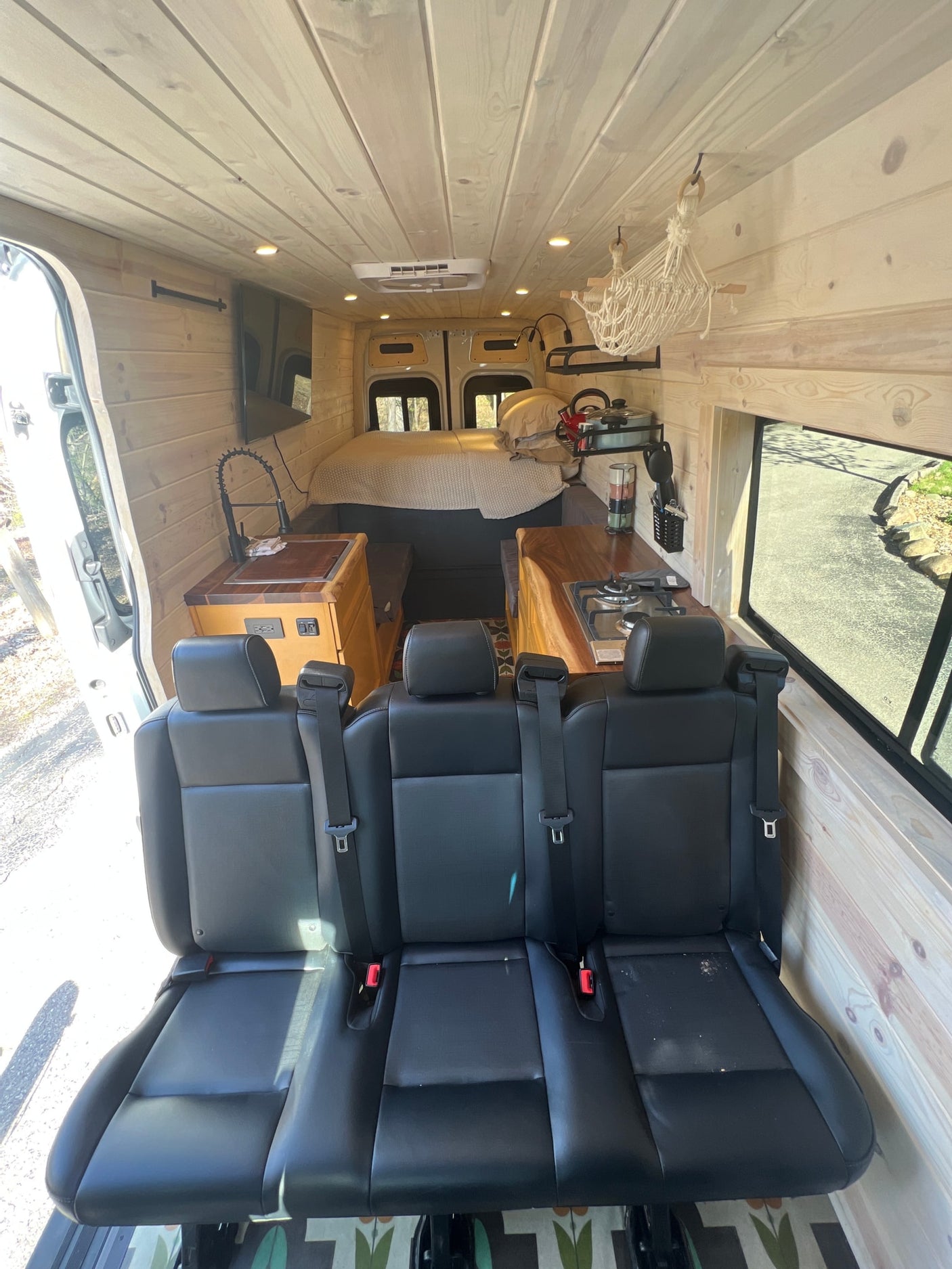 perfect for an rv rental getaway.|White Mercedes-Benz Sprinter camper van with bike rack