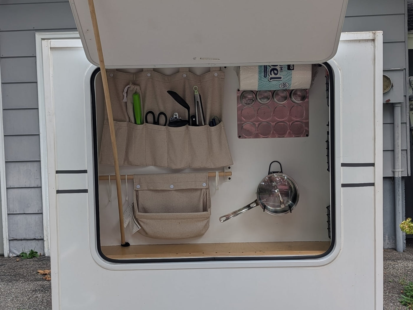 ready for travel and camping.|Compact RV rental bedroom featuring a bed with floral quilt — photo 4