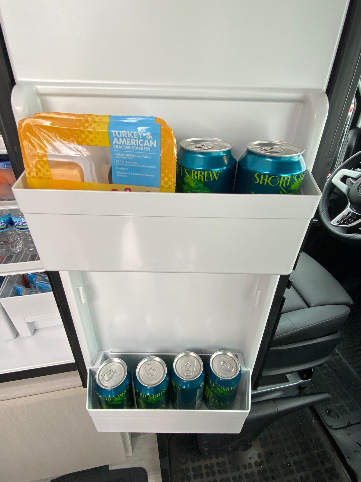 Inside an rv rental fridge: Turkey & American Cracker Stackers, plus Short's Brew cans. Road trip ready!