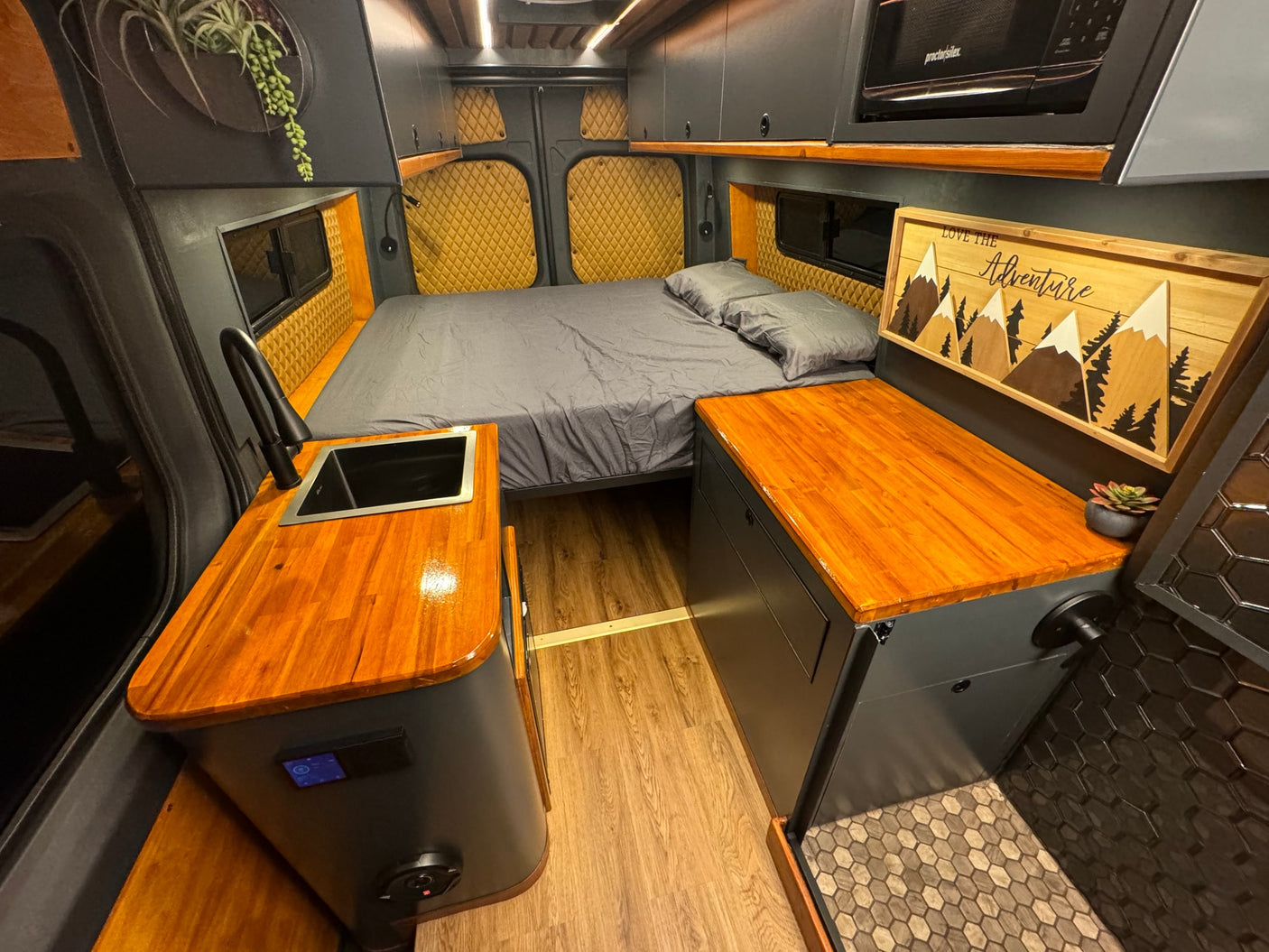 featuring a wooden ceiling & mountain views.|This RV rental's integrated system shows 97% battery