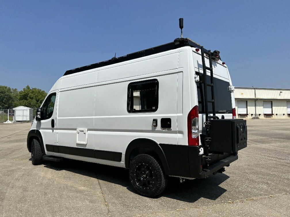 and a custom deck with lights on a white camper van. Ready for adventure.|Compact oven set to 350°F (12:57 displayed) with illuminated controls and lit interior