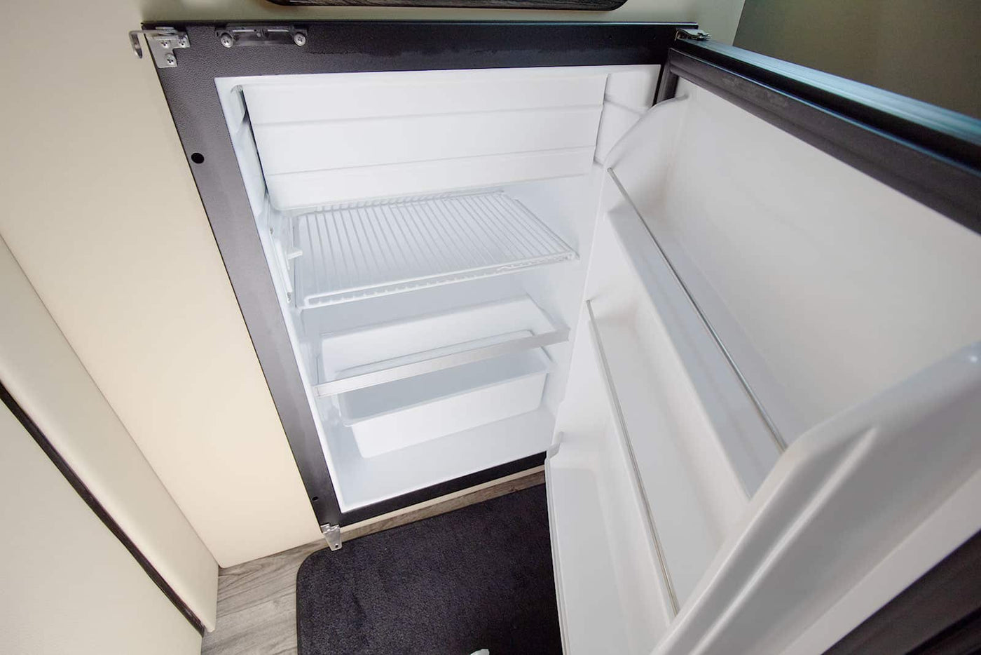 and stylish lighting create a mobile lounge.|Luxury Mercedes-Benz RV rental interior — photo 14