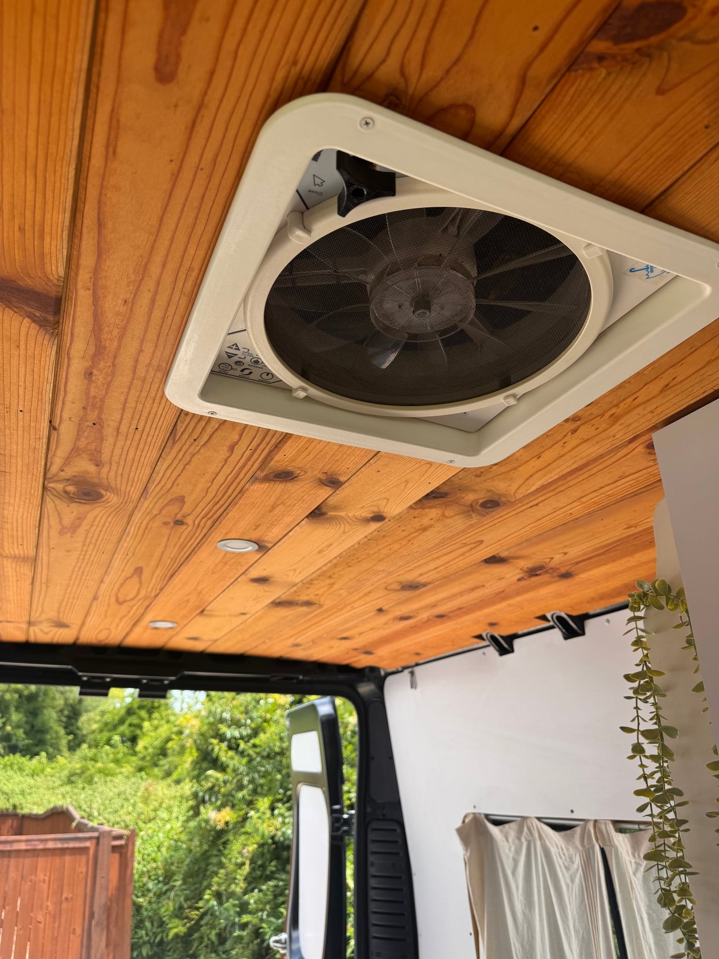 and a compact kitchen. Ideal for van life.|Compact RV rental kitchen featuring a portable dual-burner stove — photo 5