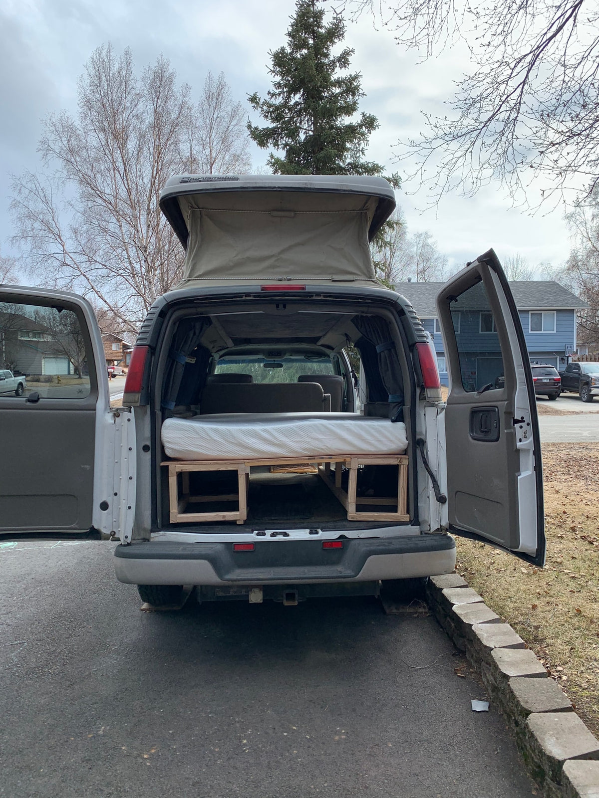 Custom Sportsmobile camper van with pop-top & bed conversion, perfect for an RV rental adventure. — photo 9