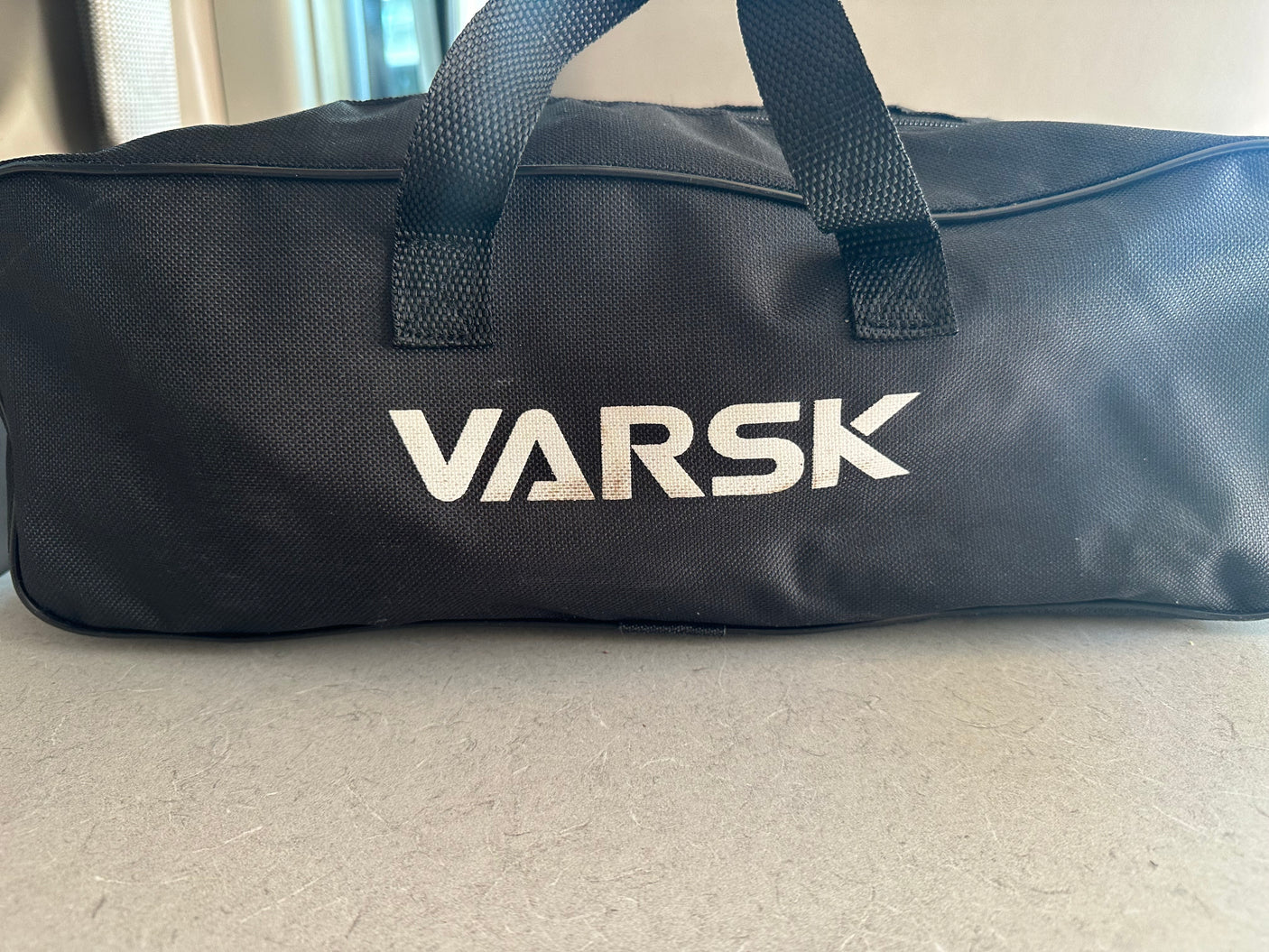 Black VARSK equipment bag with handles, ideal for your RV rental.