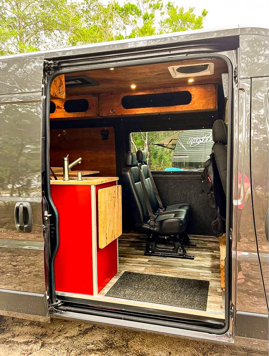 showing its dashboard and a clear view of an RV lot with customer parking.|View from the back of an RV rental