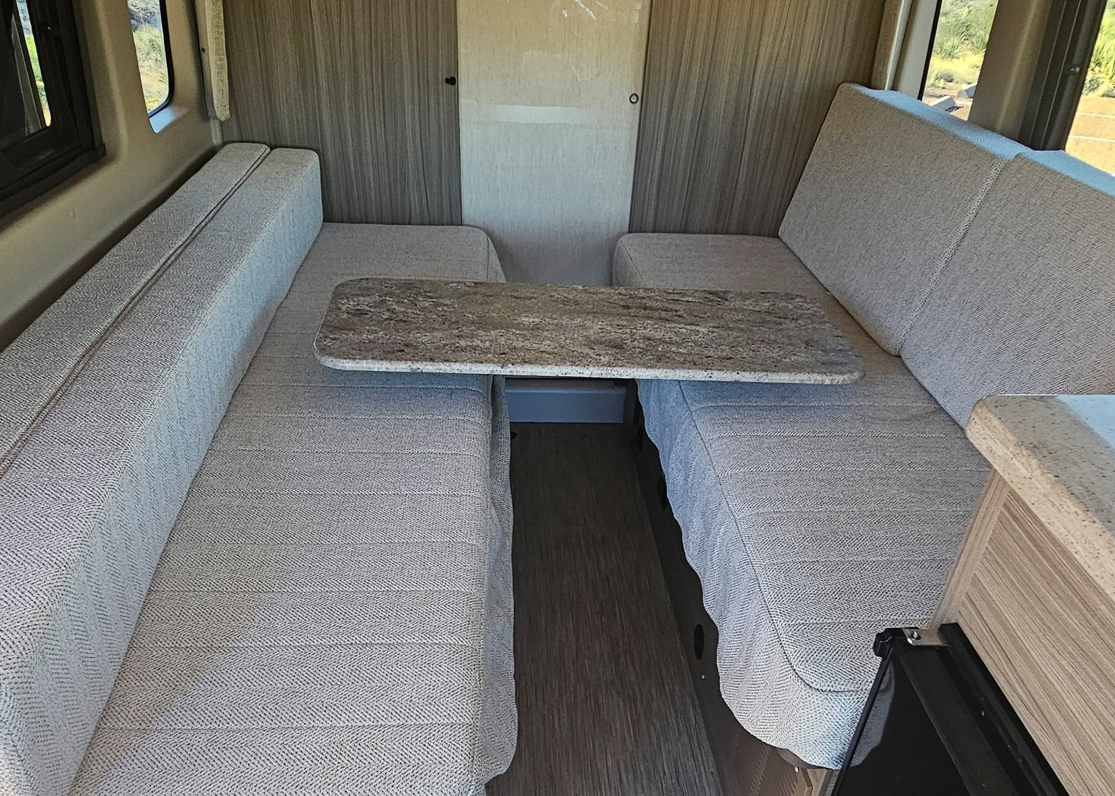 and desert views.|Inside this RV rental: a large window with desert landscape
