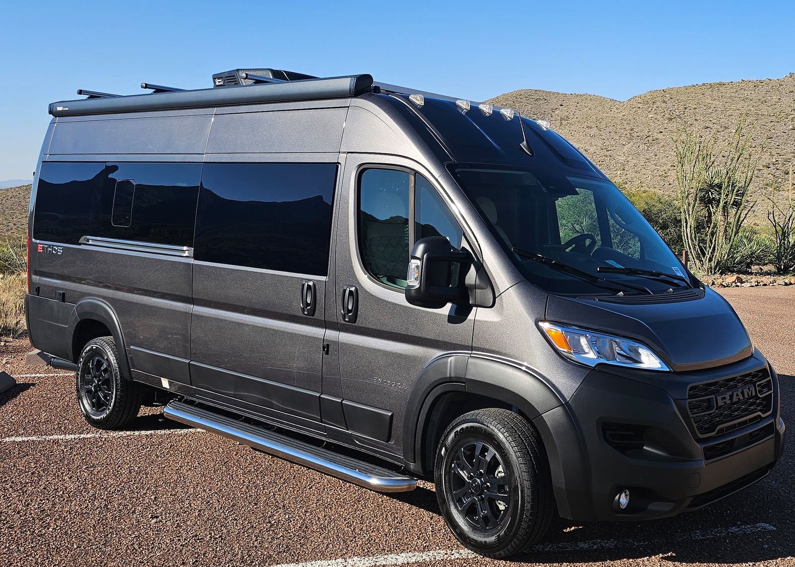 Discover adventure in this sleek gray Ram ProMaster Ethos camper van