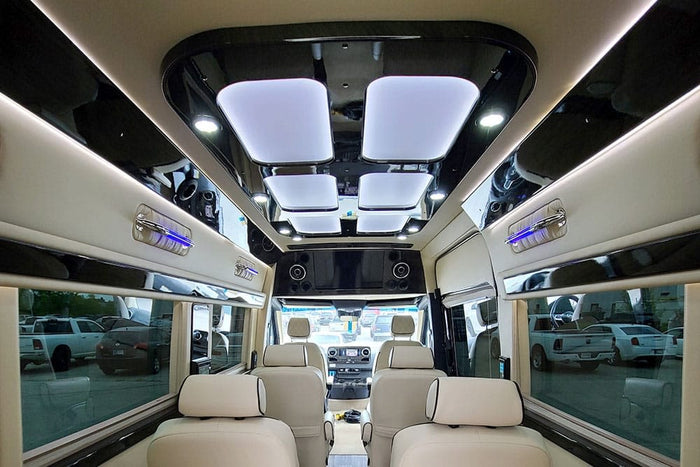 and quilted seating.|Spacious Mercedes-Benz RV rental interior from the rear