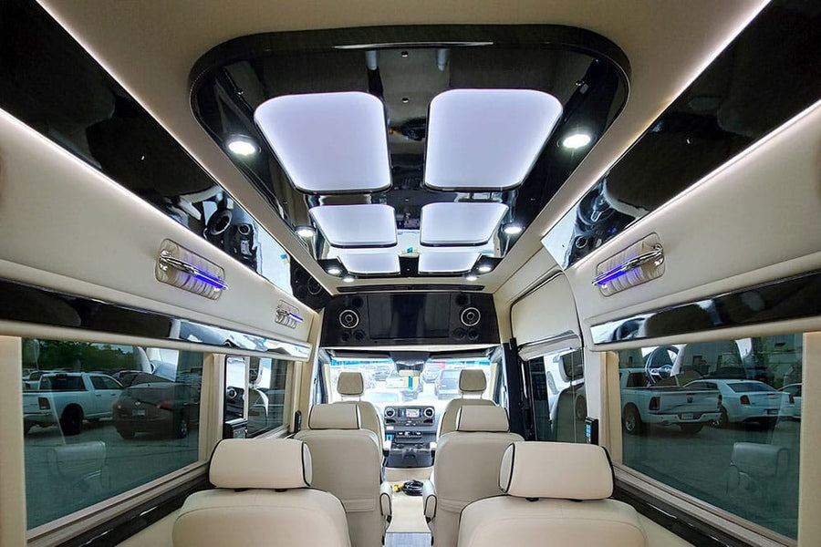 and quilted seating.|Spacious Mercedes-Benz RV rental interior from the rear