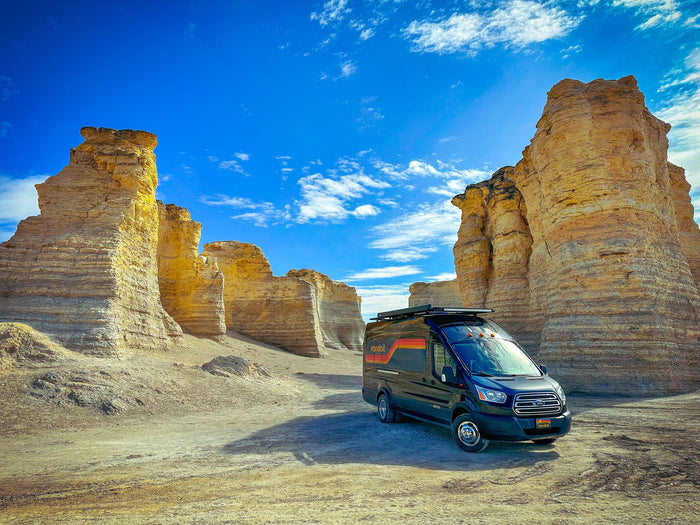 parked before impressive natural rock formations