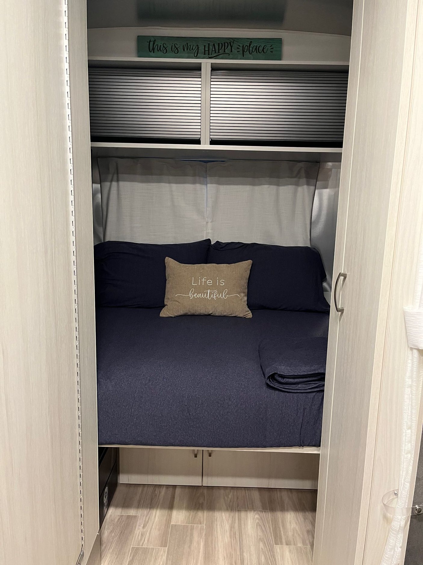 ready for an RV rental.|Inside an RV rental: a bright dinette area with blue seating