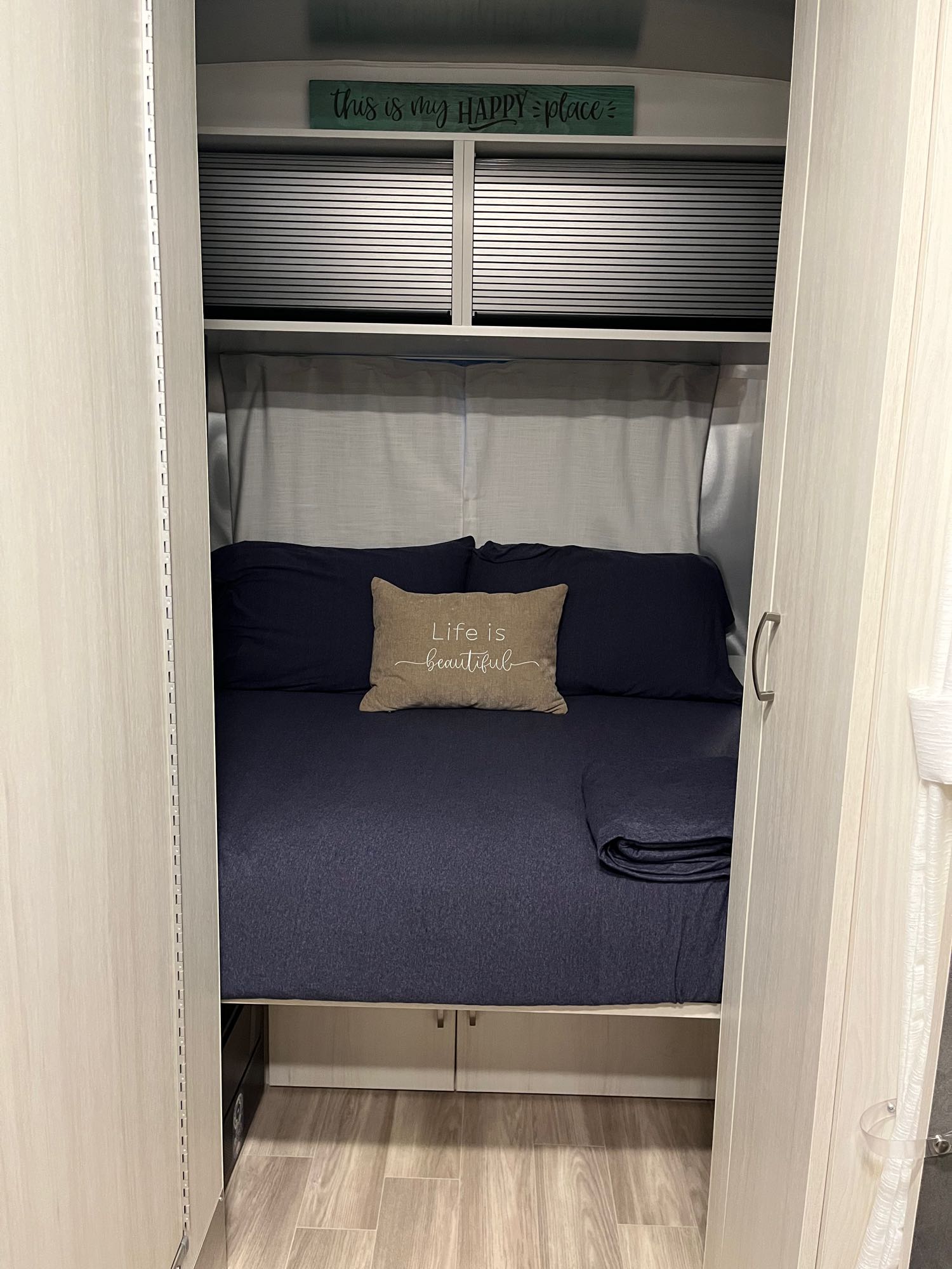 ready for an RV rental.|Inside an RV rental: a bright dinette area with blue seating