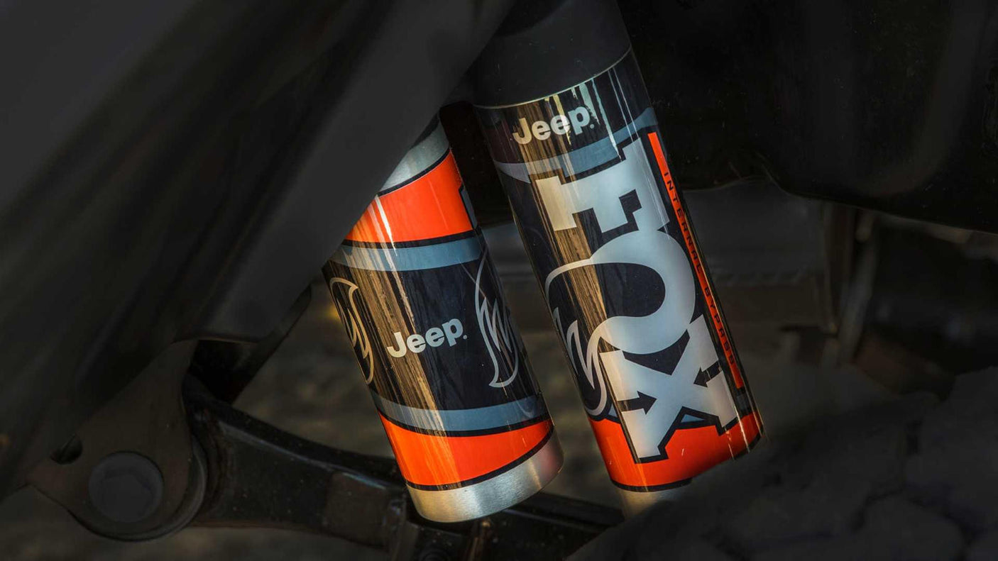 enhancing any rv rental journey.|Detailed view of Jeep-branded FOX off-road shocks