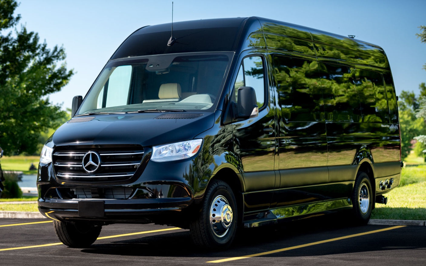 This sleek black Mercedes Sprinter van, ready for RV rental, shines under the sun. Ideal for luxury travel.