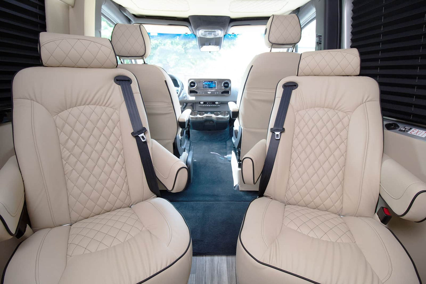 and ambient lighting. Ideal for road trips.|Silver Mercedes Sprinter rv rental parked on a snowy road among tall pines — photo 4