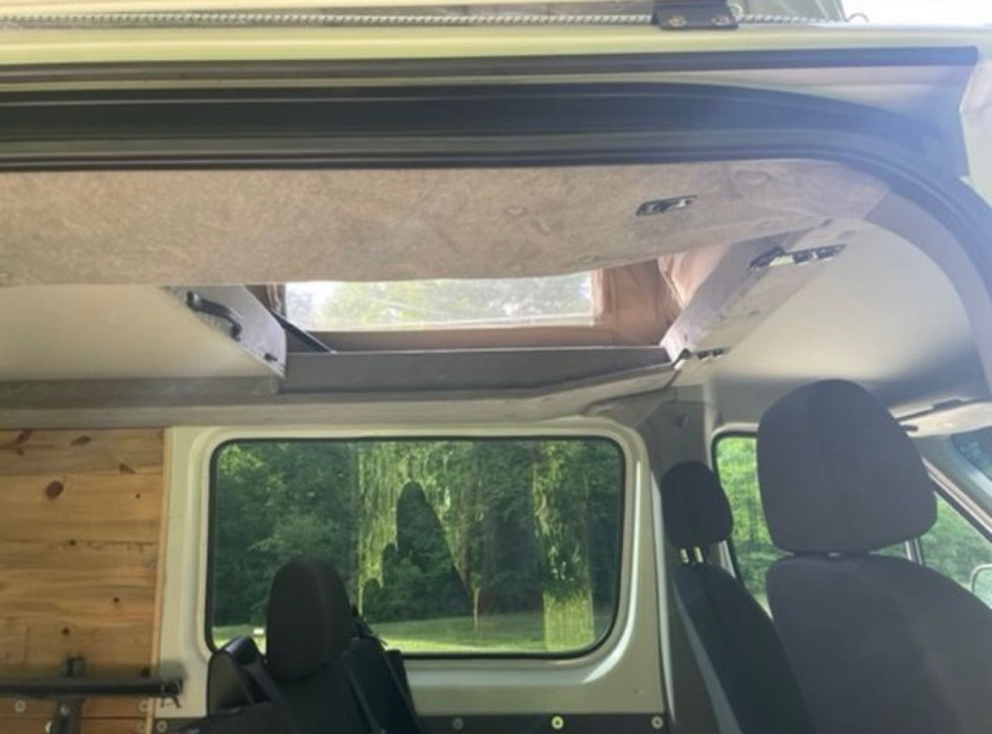 parked on a dirt road by trees. Perfect for your next RV rental adventure!|RV rental power hub: complex electrical wiring