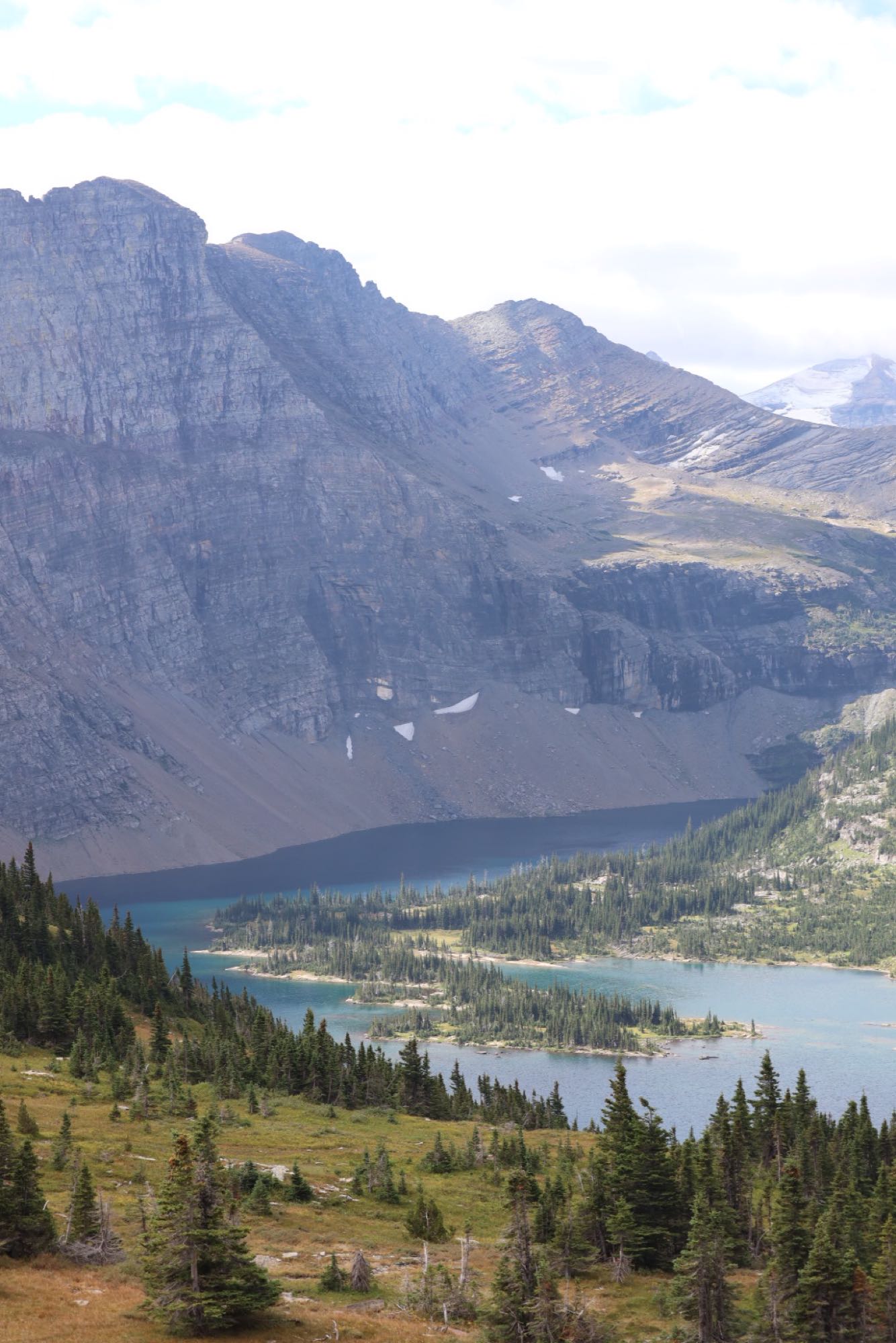 Panoramic mountain range, turquoise lakes, and dense forests. An RV rental is perfect for this scenic nature travel.