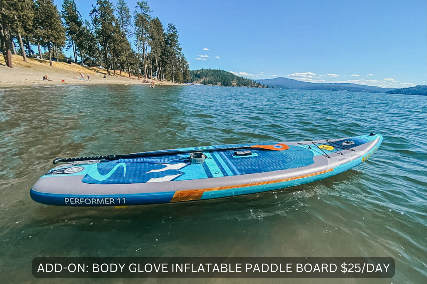 RV rental enhancement: Rent a Body Glove paddle board for lake activities. Beach and forested mountains nearby.