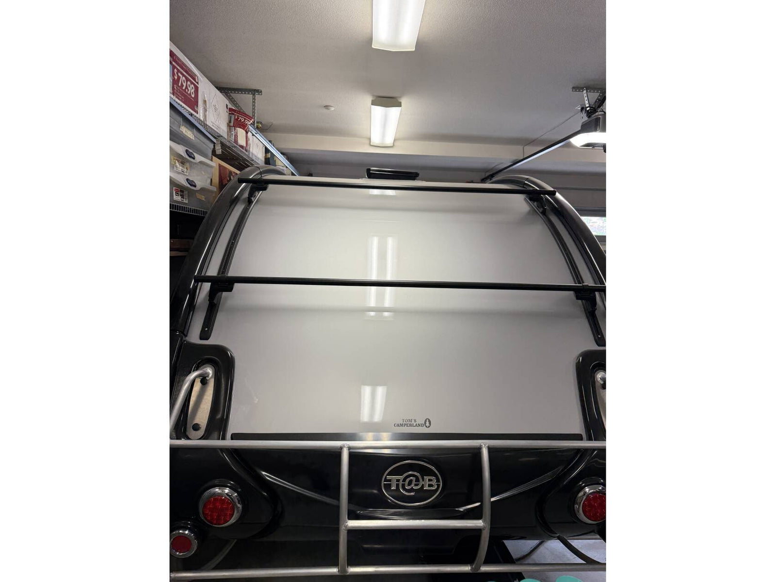 ideal for a comfortable camper trip.|Explore the outdoors with this grey nuCamp Boondock teardrop camper