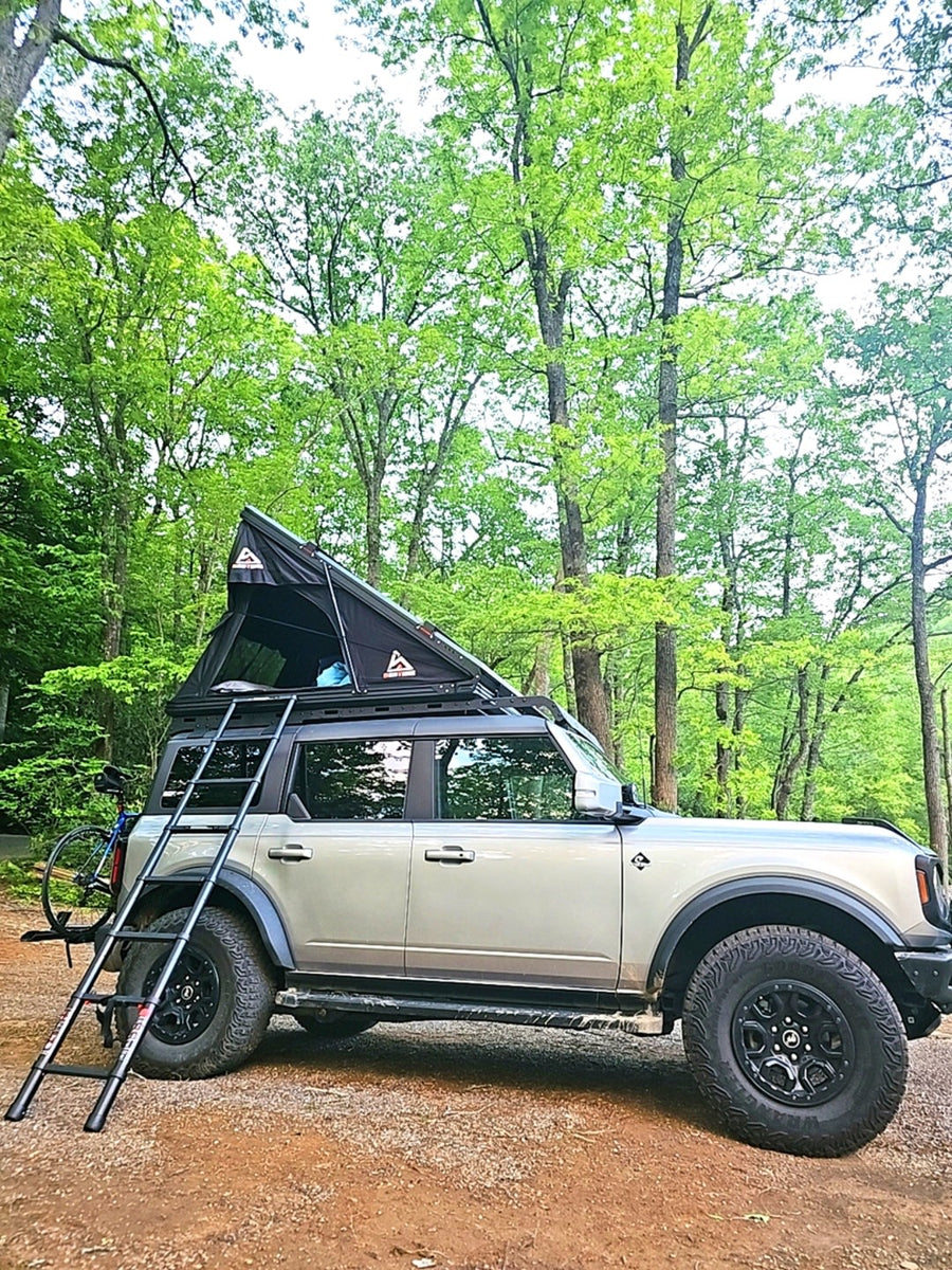 perfect for overlanding. A unique RV rental option!|Ford Bronco SUV with rooftop tent & ladder for camping