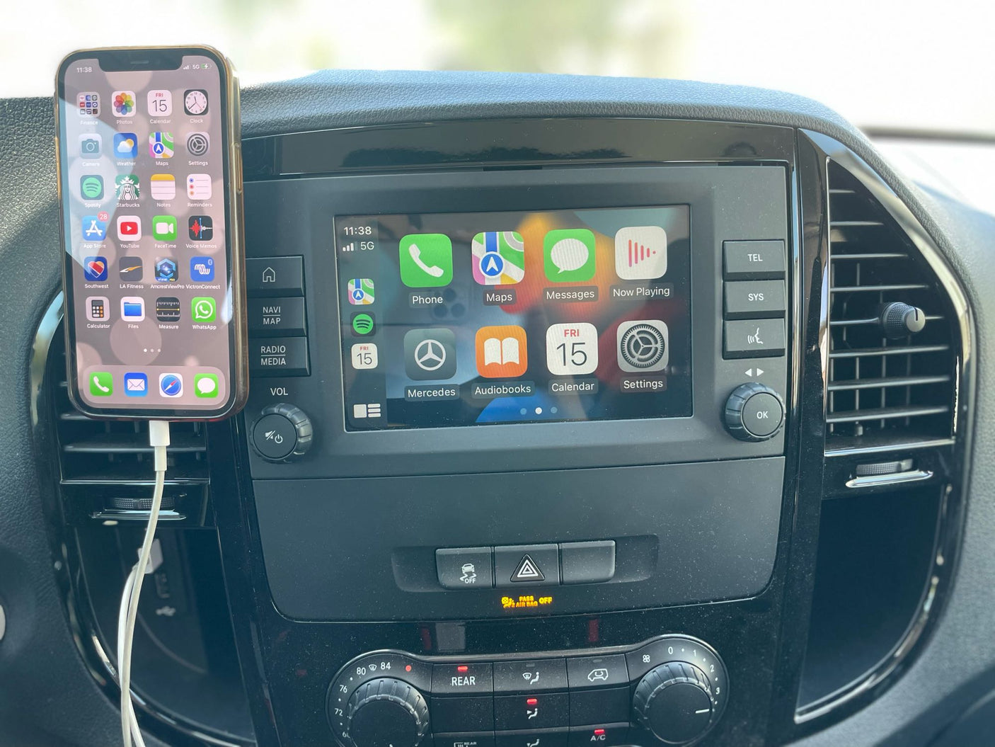 Modern rv rental interior with smartphone and infotainment display for navigation and entertainment on the go.