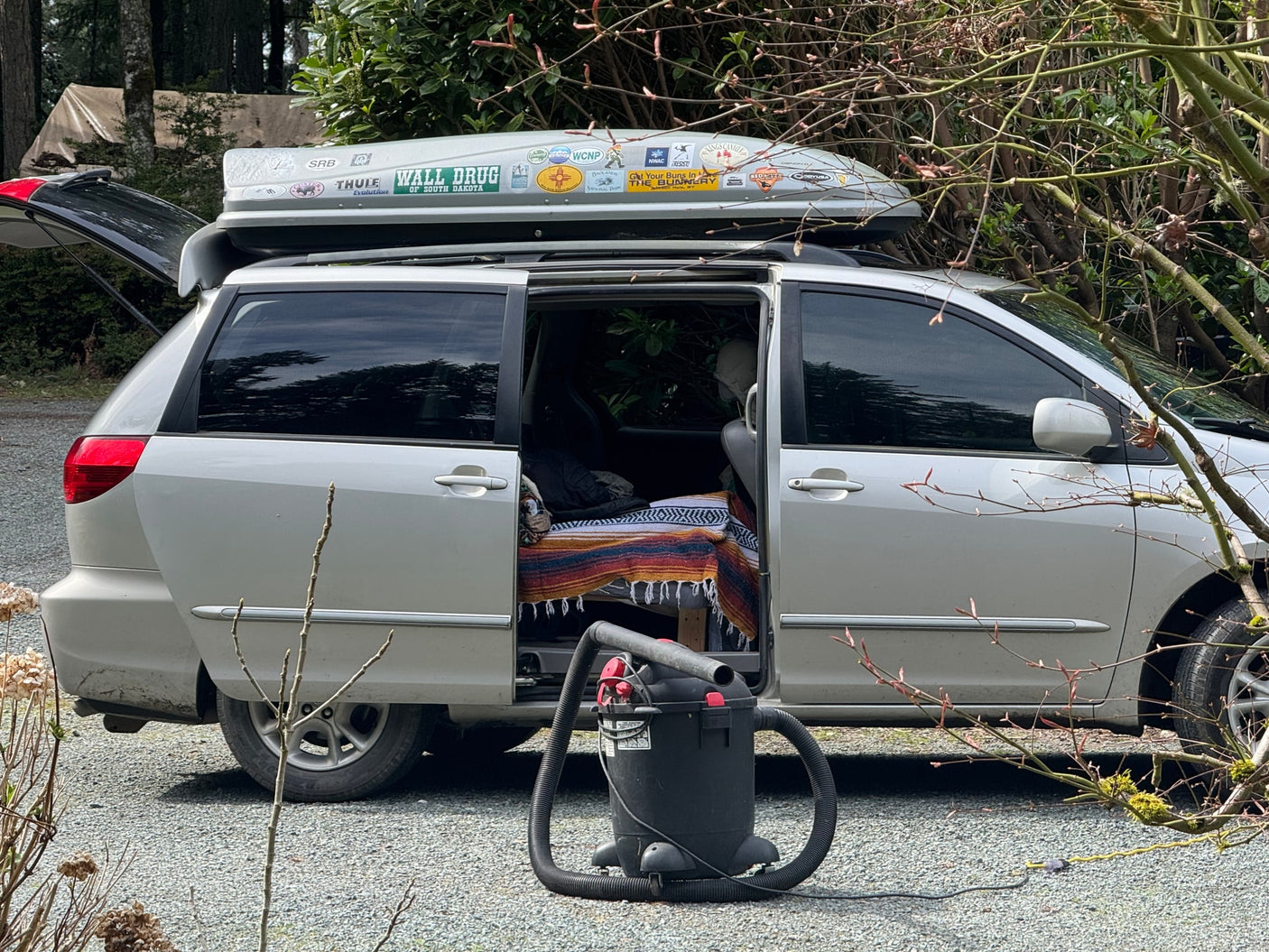 perfect for your next RV rental adventure.|Curious tabby cat on a silver minivan with a roof cargo box