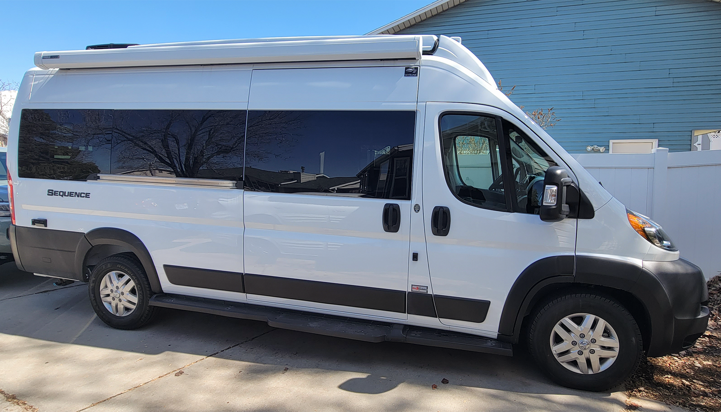 White Thor Sequence camper van, parked outside on a sunny day, ideal for your next RV rental adventure.
