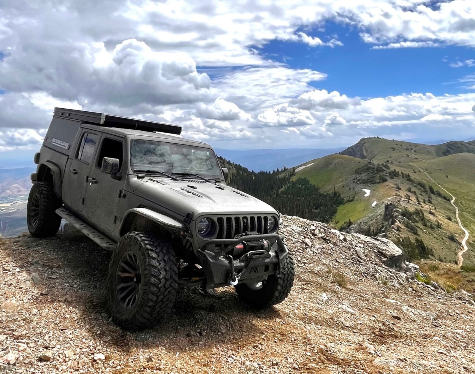 Overland Jeep Gladiator on a mountain peak