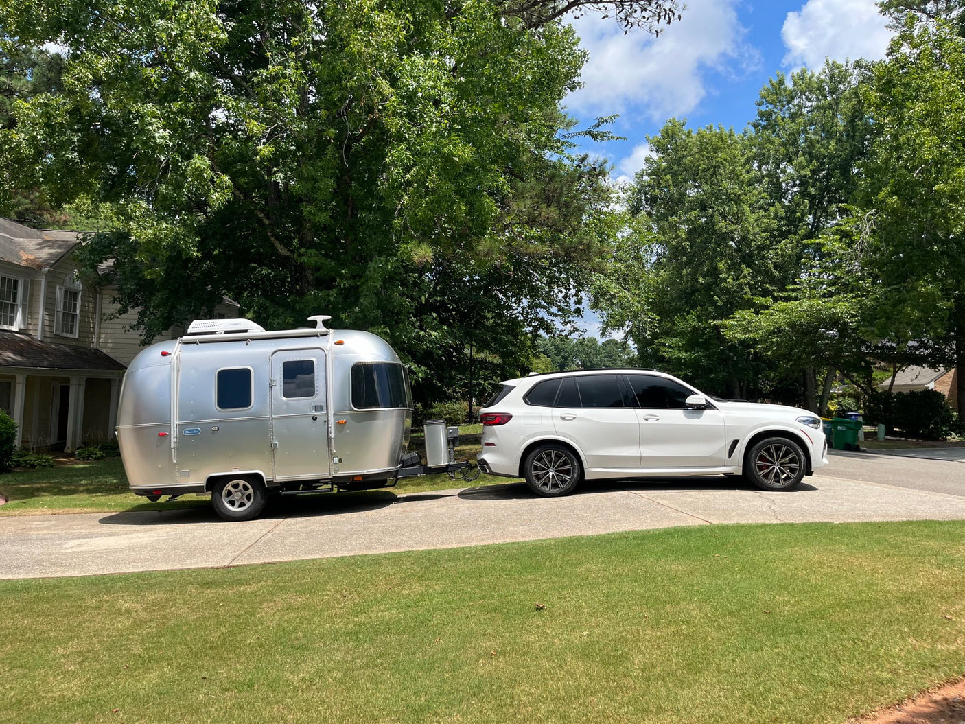 parked on a gravel campsite amidst dense forest