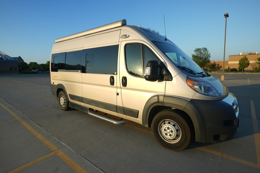 A cream-colored camper van