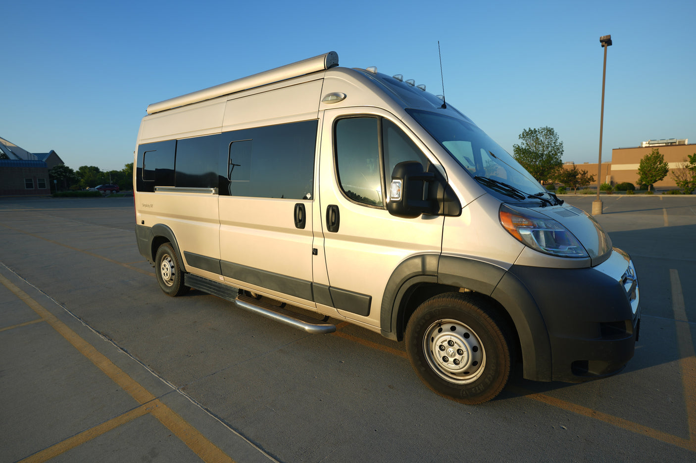A cream-colored camper van