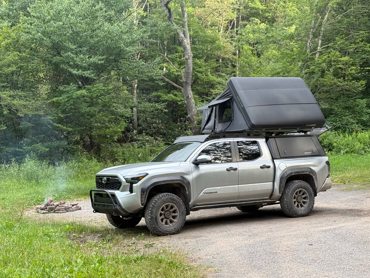 and view out a window.|Interior of an off-road RV rental's rooftop tent — photo 12