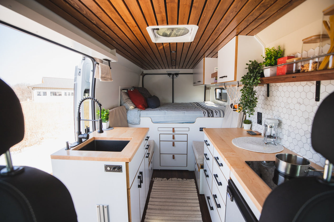 Bright RV rental interior: a modern van conversion with light wood counters