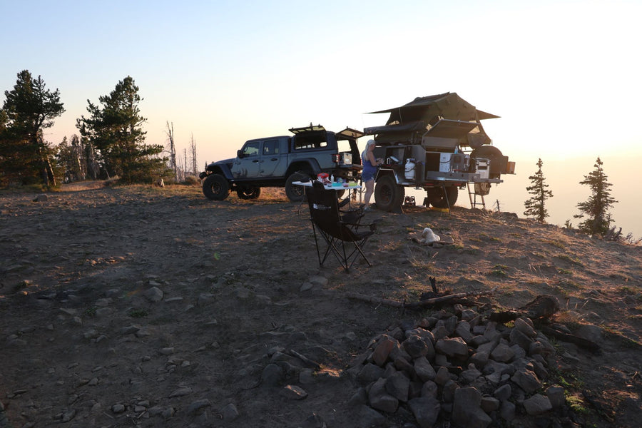 Scenic overlanding camp: Jeep & trailer with rooftop tent