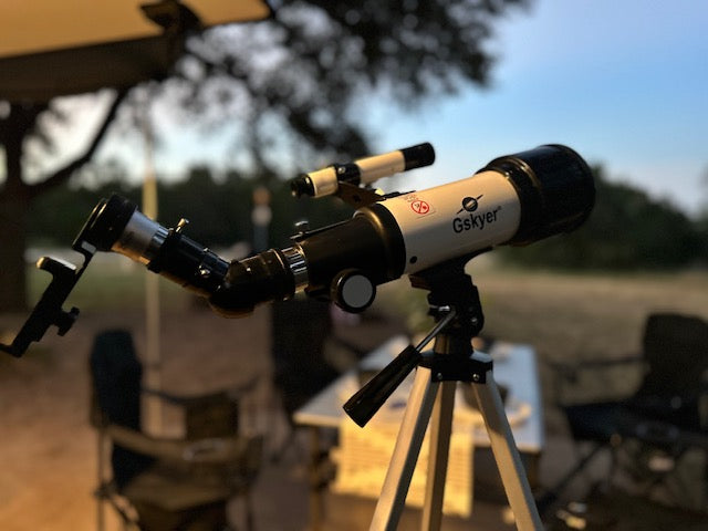 A Gskyer telescope is set for stargazing on an RV rental trip, ideal for celestial camping views.
