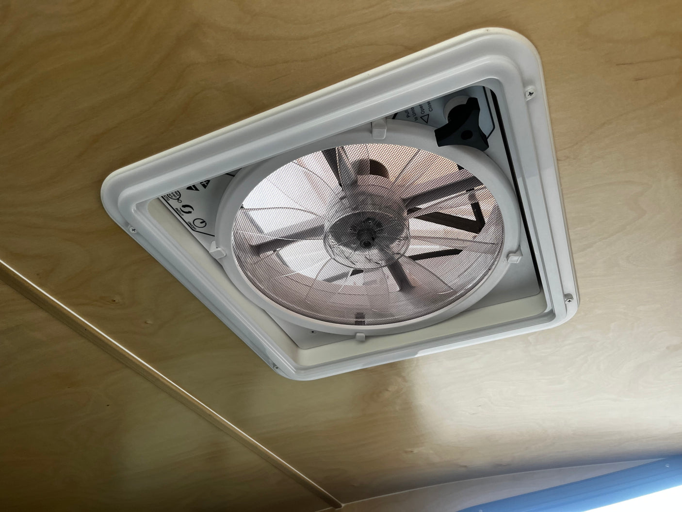 Efficient RV rental interior with a functional ceiling fan vent, providing comfortable airflow for your adventure.