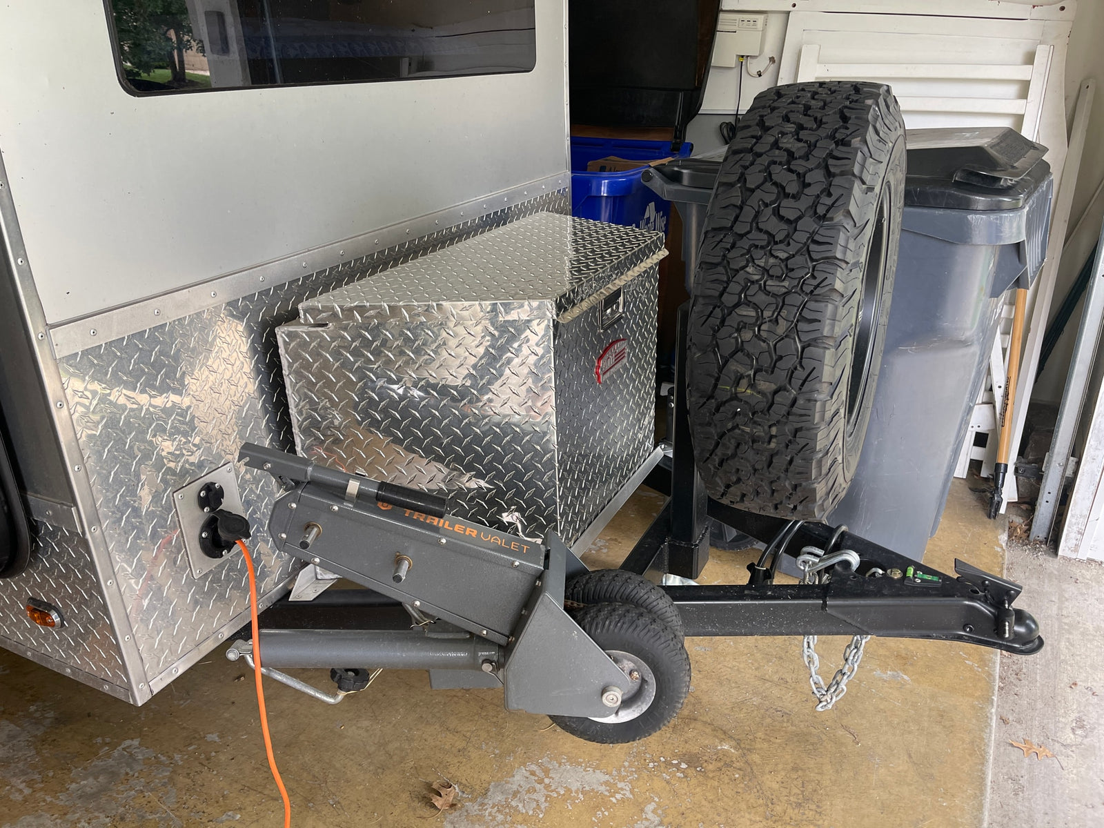 with a stuffed dragon on the top bunk and a Coleman sleeping bag below. Ideal for camping.|Cozy rv rental: small camper interior with two narrow beds
