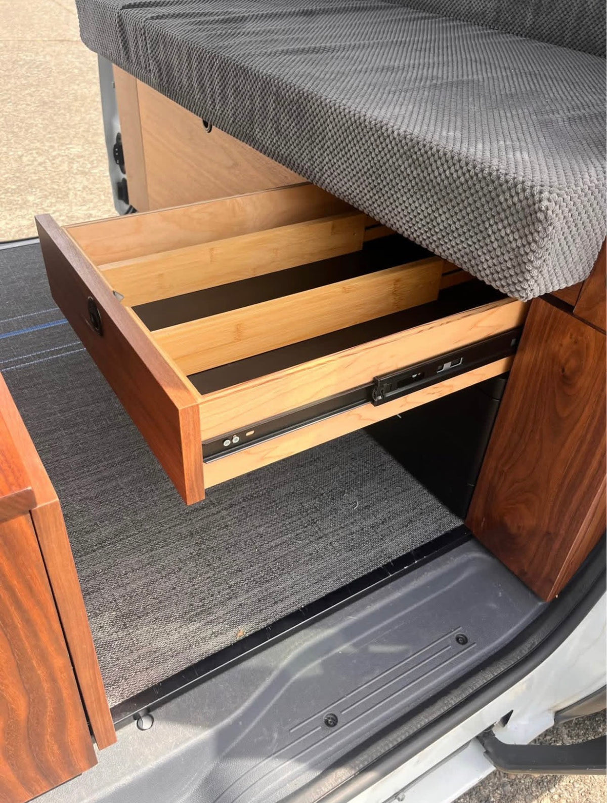 and integrated power unit for comfortable journeys.|Sleek rv rental van interior featuring a warm wood ceiling — photo 10