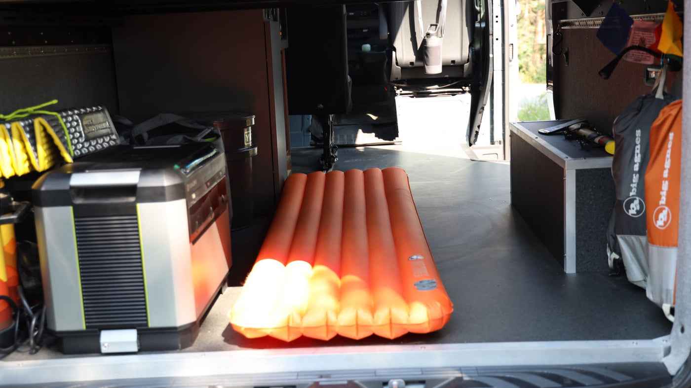 shows off its roof rack & ladder.|Inside an rv rental: custom camper van interior with a kitchen — photo 10