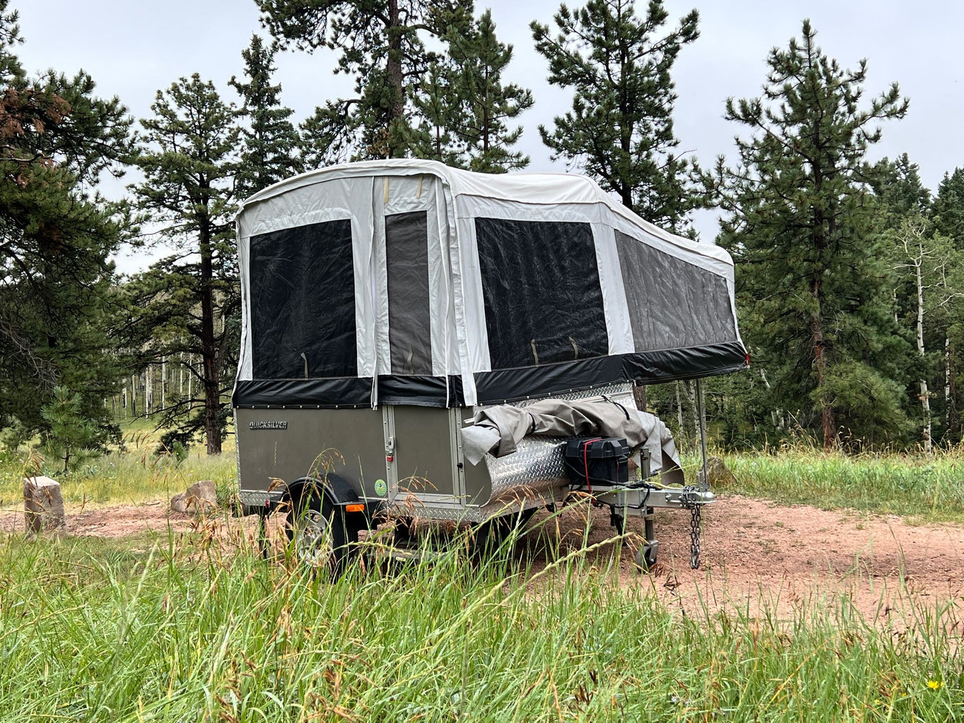 and outdoor views for camping and travel.|Inside a Quicksilver RV rental: cozy dinette area with table