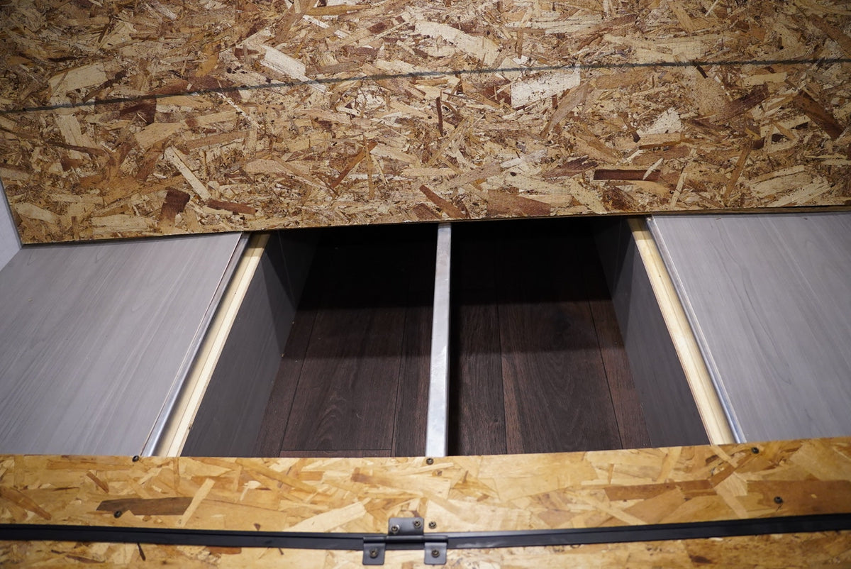 ready for your trip.|Compact RV rental interior featuring a comfy bench — photo 5