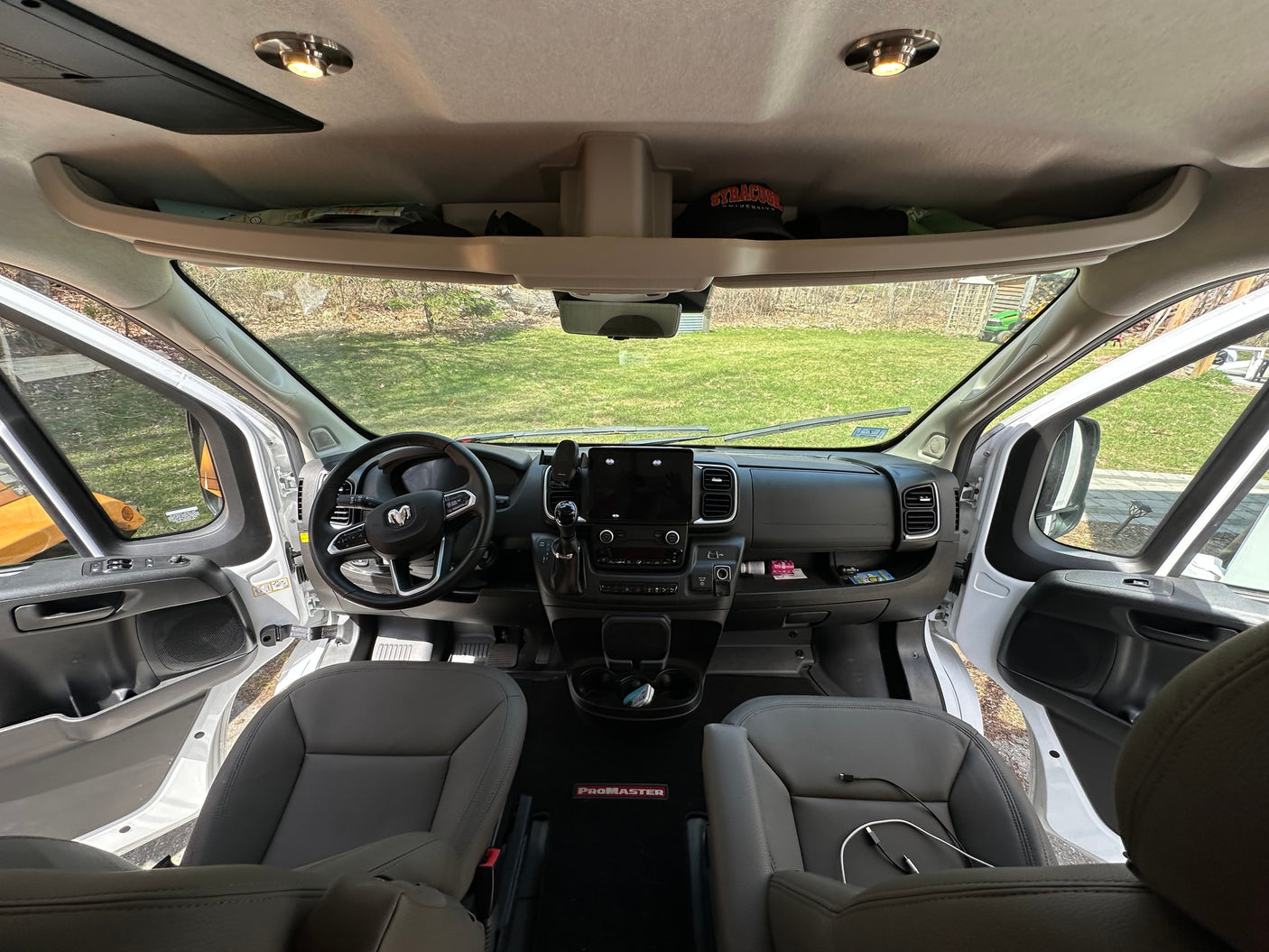 and cozy living area with seating.|RV rental van interior: view of the modern dashboard